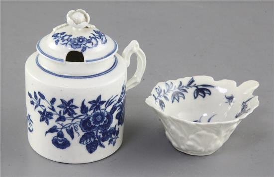 A Worcester Mansfield pattern butter boat, c.1760 and a Worcester floral pattern mustard pot and cover, c.1770, 9cm and 9.5cm